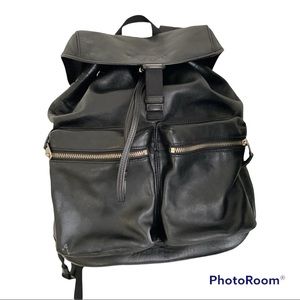 Coach black leather unisex backpack.